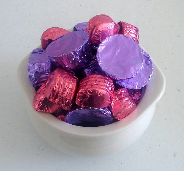 Bowl of multi colored chocolates